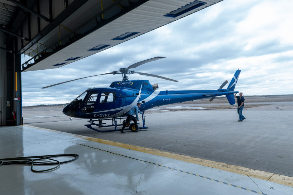 Vortex helicopter at the open hangar entrance